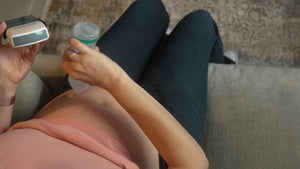 A short video showing a woman with gel on her belly, applying gel to the transducer of the Pulsenmore home ultrasound device. She then begins scanning her belly, following a guidance video playing on the other side of the screen and on her phone.

The screen then transitions to the clinician’s dashboard, where the scans are displayed as the clinician reviews and interprets them.
